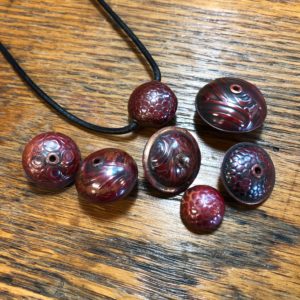 Copper Beads fired to a red patina.